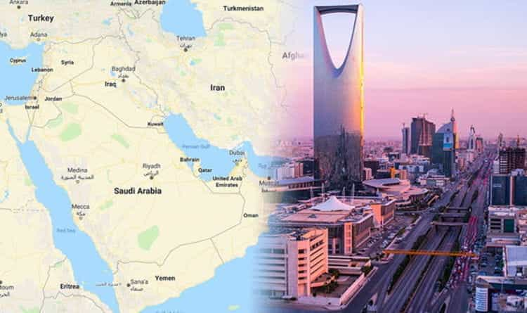 Saudi Arabia on a map next to a cityscape.