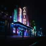 A neon casino sign at night.