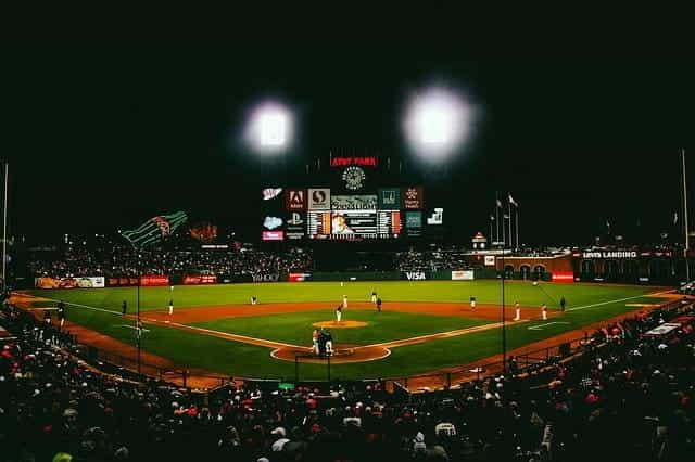 A packed baseball stadium in San Francisco, California at night.