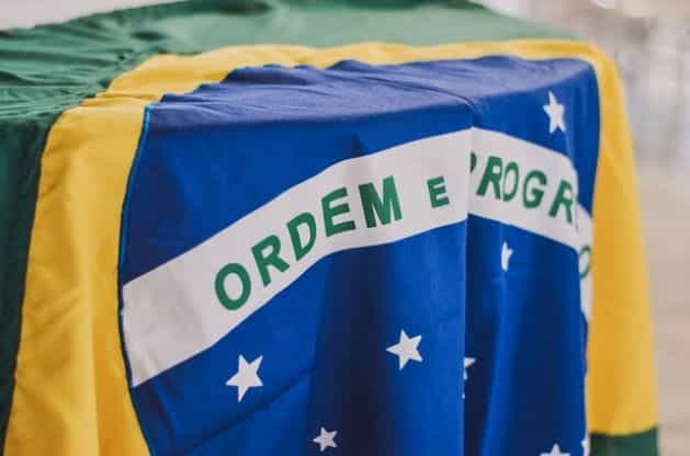 A closeup of the Brazilian flag draped across a table.