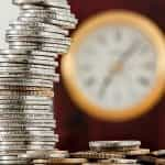 A tall stack of silver and bronze coins.