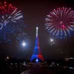 Fireworks explode above the Eiffel Tower in Paris.