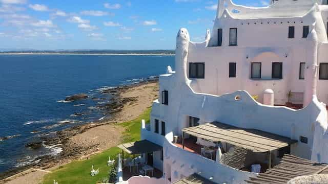 A multi-level white stucco house on the coast of Punta del Este, Uruguay.