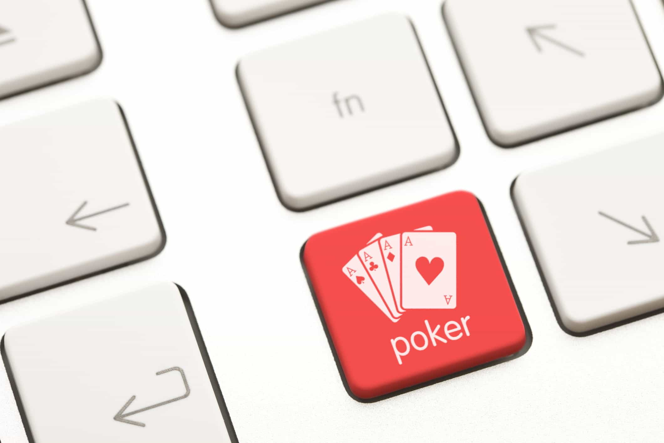 Red computer key with an aces image and the word poker written on it.