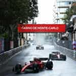 Charles Leclerc racing on wet Monaco streets in 2022.