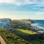 Colorful buildings on a brightly lit coastline at San Juan, Puerto Rico.