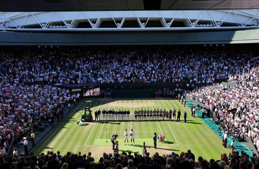 Novak Djokovic and Nick Kyrgios hold their trophies after the Men's Singles Final at Wimbledon.