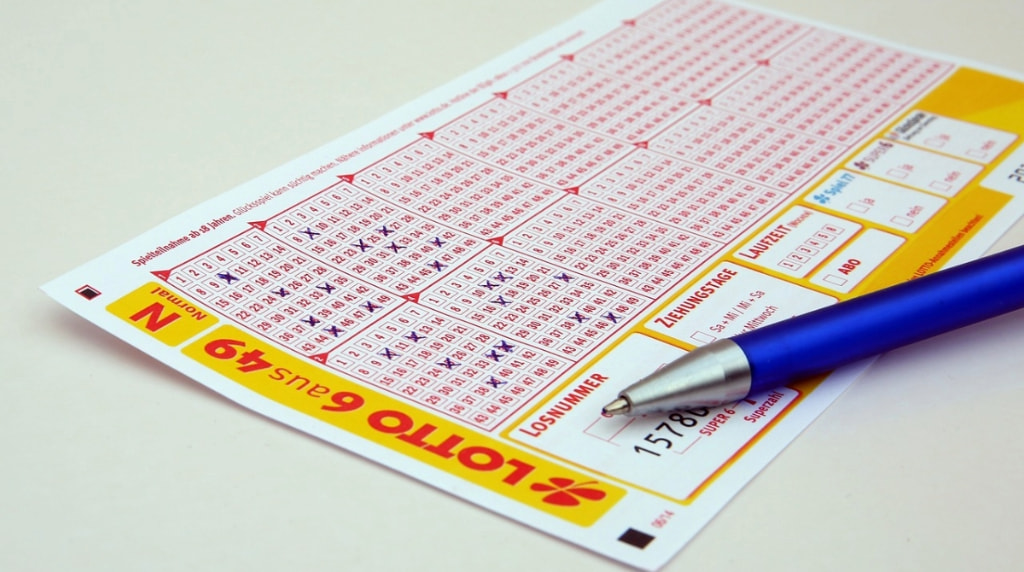 A Lottery Ticket Getting Filled with Pen